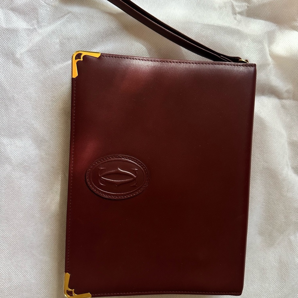 Cartier Burgundy Leather Clutch with Gold Accents